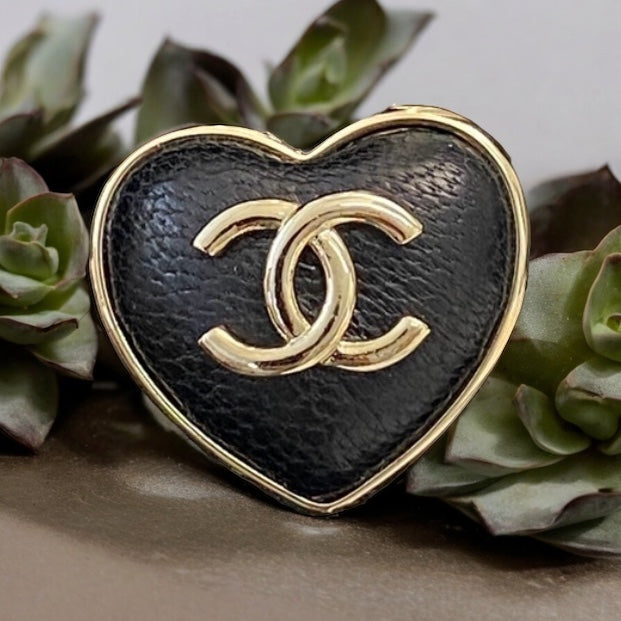 Chanel Gold Strass Heart Black Leather Double C Brooch PinChanel Gold , Strass and Black Soft Looking Heart Shaped Pin Perfect minimalistic size - Little bigger than a U.S. quarter coin . Clearly stamped on the back S22 22A Made in France On consignment L