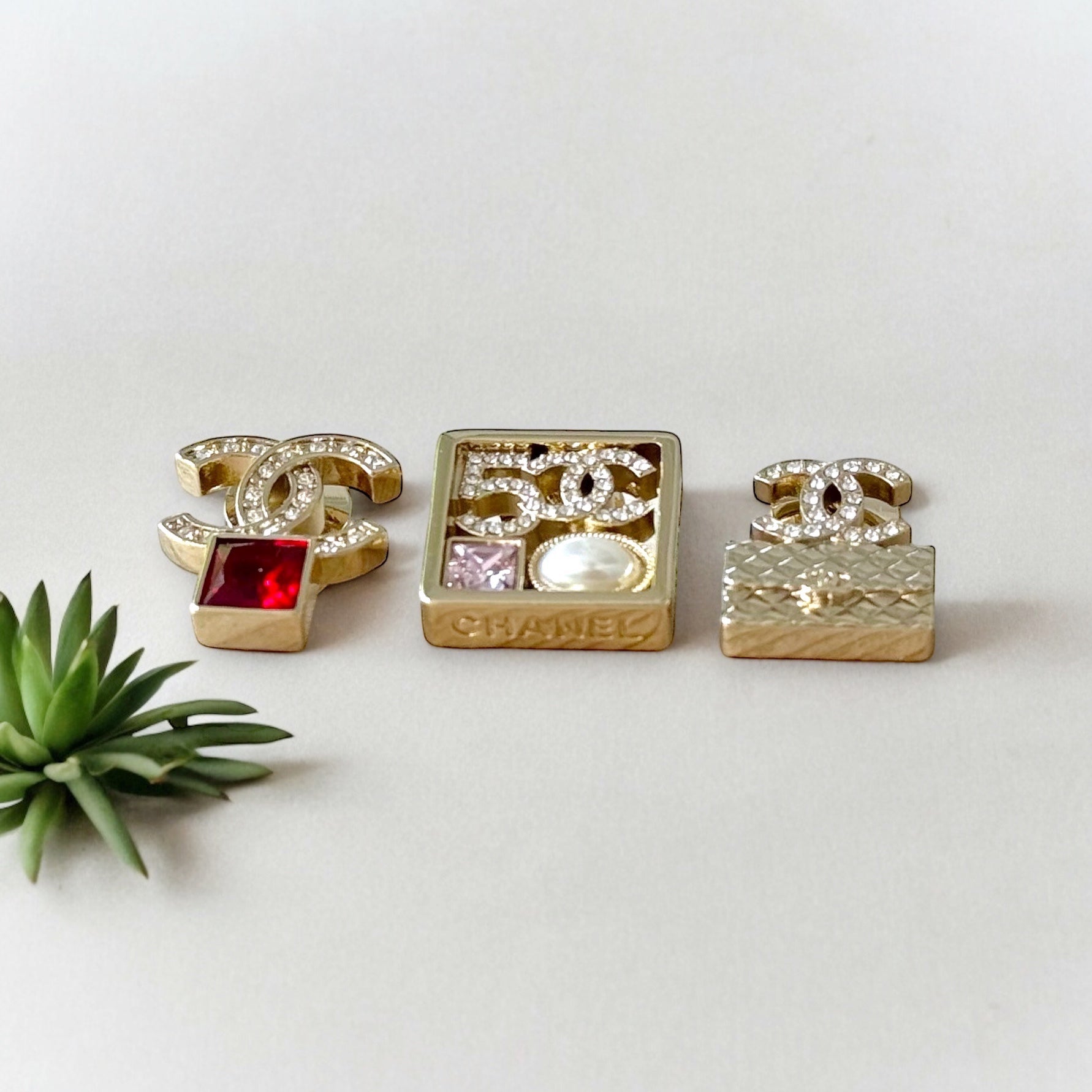 Chanel Strass Lighter Gold Set of 3 Crystal Encrusted Double C Cut Out Brooch PinsEmbrace daring style with this set of 3 Chanel brooch pins. Each one is uniquely designed, with crystal encrusted C-cutouts in a striking gold tone. Add these to any outfit