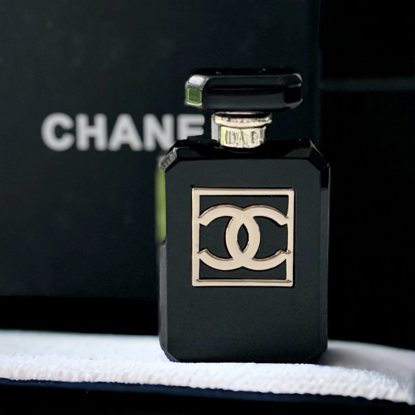 Chanel Black Lucite With Double C Gold Accents Brooch PinIconic with this classic Chanel Number Five Black Lucite Brooch Pin. Featuring smooth gold double C and accent details, this unique piece will make you stand out. A must-have for any fashion lover!