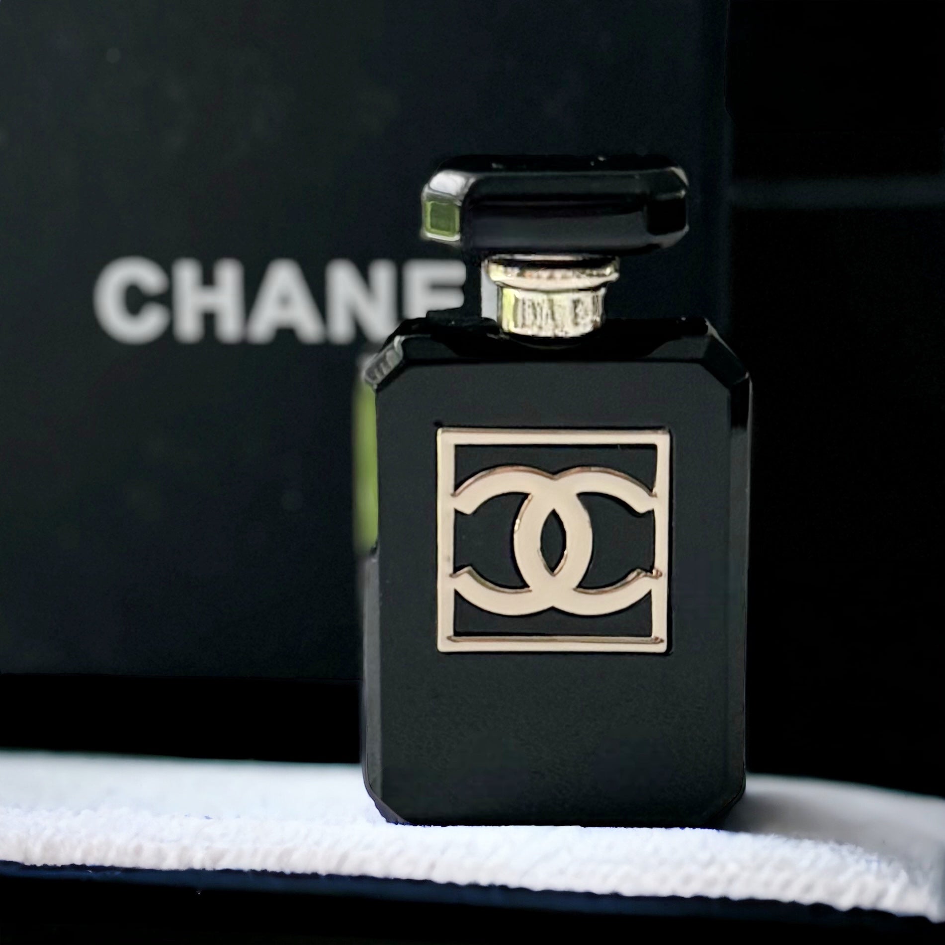 Chanel Black Lucite With Double C Gold Accents Brooch PinIconic with this classic Chanel Number Five Black Lucite Brooch Pin. Featuring smooth gold double C and accent details, this unique piece will make you stand out. A must-have for any fashion lover!