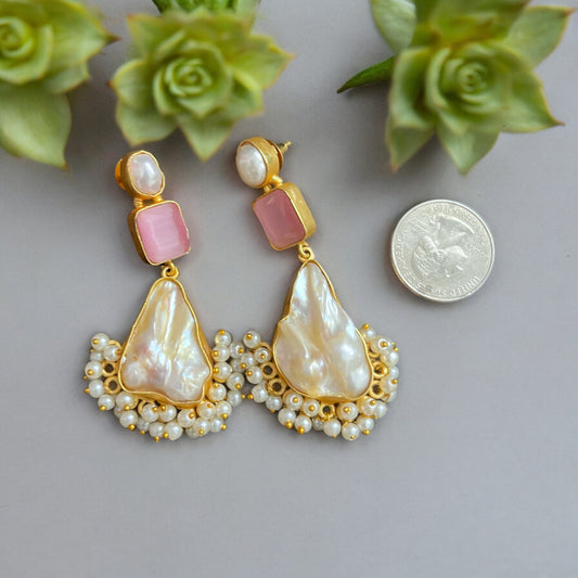 Artisan Made Gold Wire Baroque Pearls With Pink Crystal Post Dangle EarringsStep up your earring game with these Artisan Made Gold Wire Baroque Pearls With Pink Crystal Post Dangle Earrings! Real baroque pearls and hollow gold plated wire make these boho