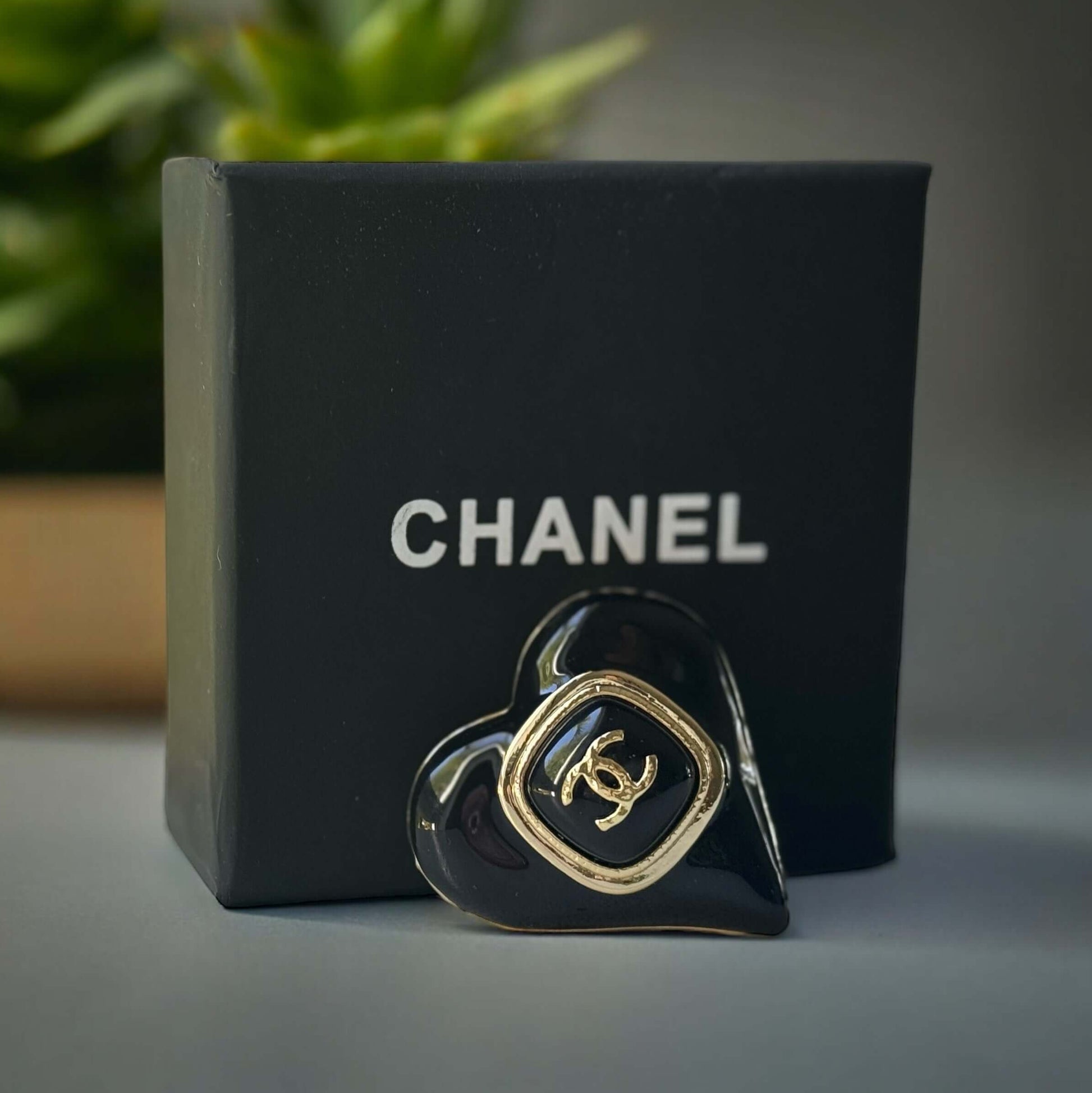 Chanel Gold Plated with Smooth Black Enamel Double C accents Heart Shaped Brooch PinAdd a touch of playful glam with this Chanel Gold Plated Heart Shaped Brooch. Featuring a sleek black enamel design and updated double C logo, this brooch is in like-new c