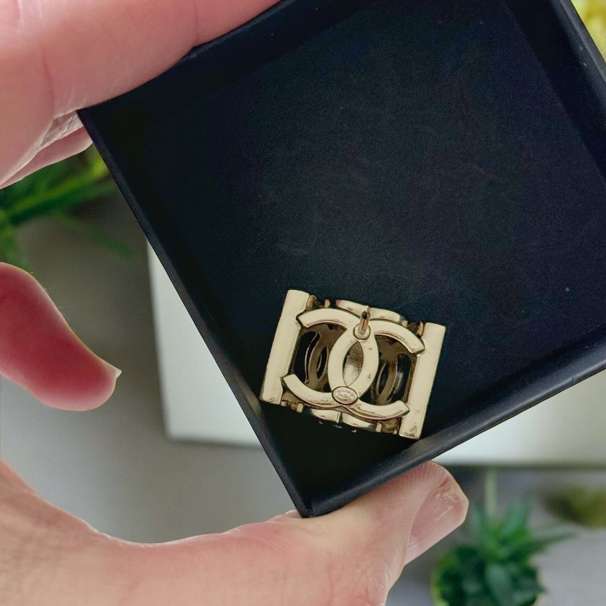 Chanel Lighter Gold Double C with Crystals Triangle Styled Smaller Brooch PinSet your style on fire with the Chanel Lighter Gold Double C brooch pin. Covered in dazzling crystals, this triangular piece adds a touch of bling to any outfit. Playfully chic,