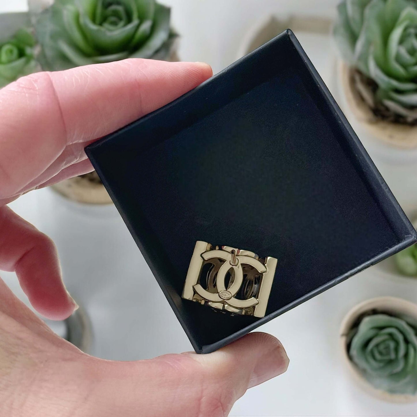 Chanel Lighter Gold Double C with Crystals Triangle Styled Smaller Brooch PinSet your style on fire with the Chanel Lighter Gold Double C brooch pin. Covered in dazzling crystals, this triangular piece adds a touch of bling to any outfit. Playfully chic,