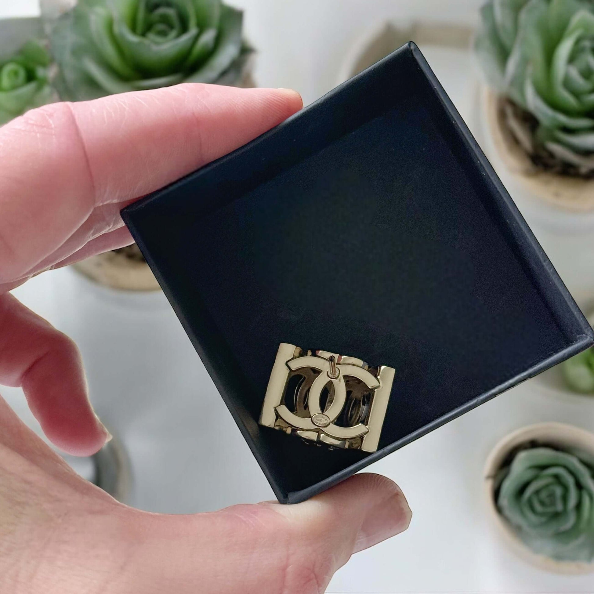 Chanel Lighter Gold Double C with Crystals Triangle Styled Smaller Brooch PinSet your style on fire with the Chanel Lighter Gold Double C brooch pin. Covered in dazzling crystals, this triangular piece adds a touch of bling to any outfit. Playfully chic,
