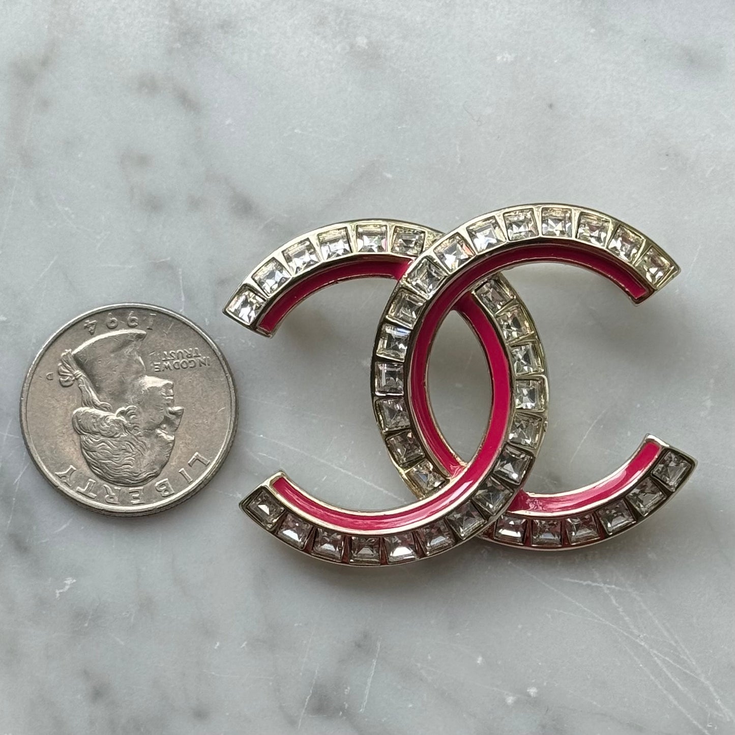 Chanel Gold Pink Enamel with Clear Crystals S24 Brooch PinTruly stunning On consignment Chanel Double C with square clear cut crystals and Pink Enamel Brooch Pin Clear Logo on the back Comes with the original Chanel Box & Bag Gift Giving Condition Free fr