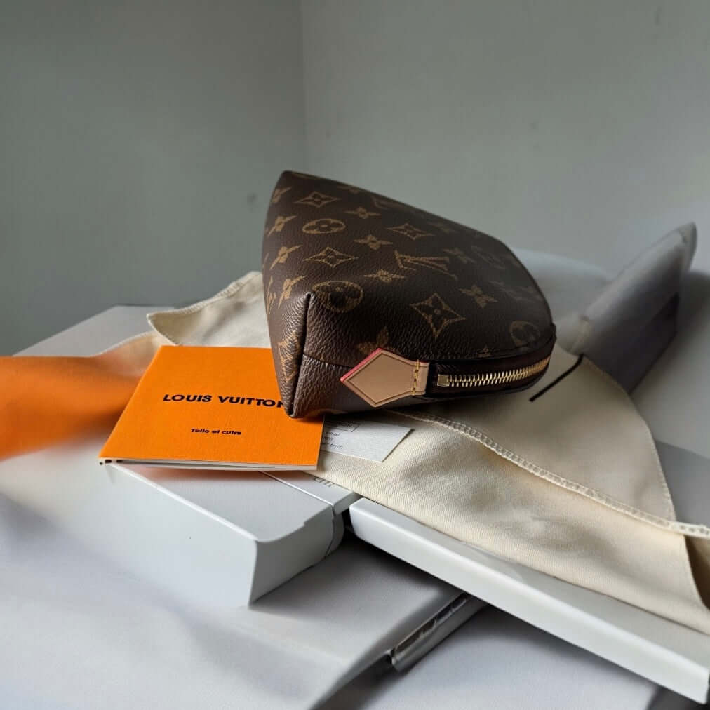 Louis Vuitton Monogrammed Pouch Never UsedOwn this Louis Vuitton Monogrammed Pouch and add a touch of classic style to your wardrobe. Never used and on consignment, it comes with a dust bag for protection. Perfect size for on-the-go adventures. Take a ris