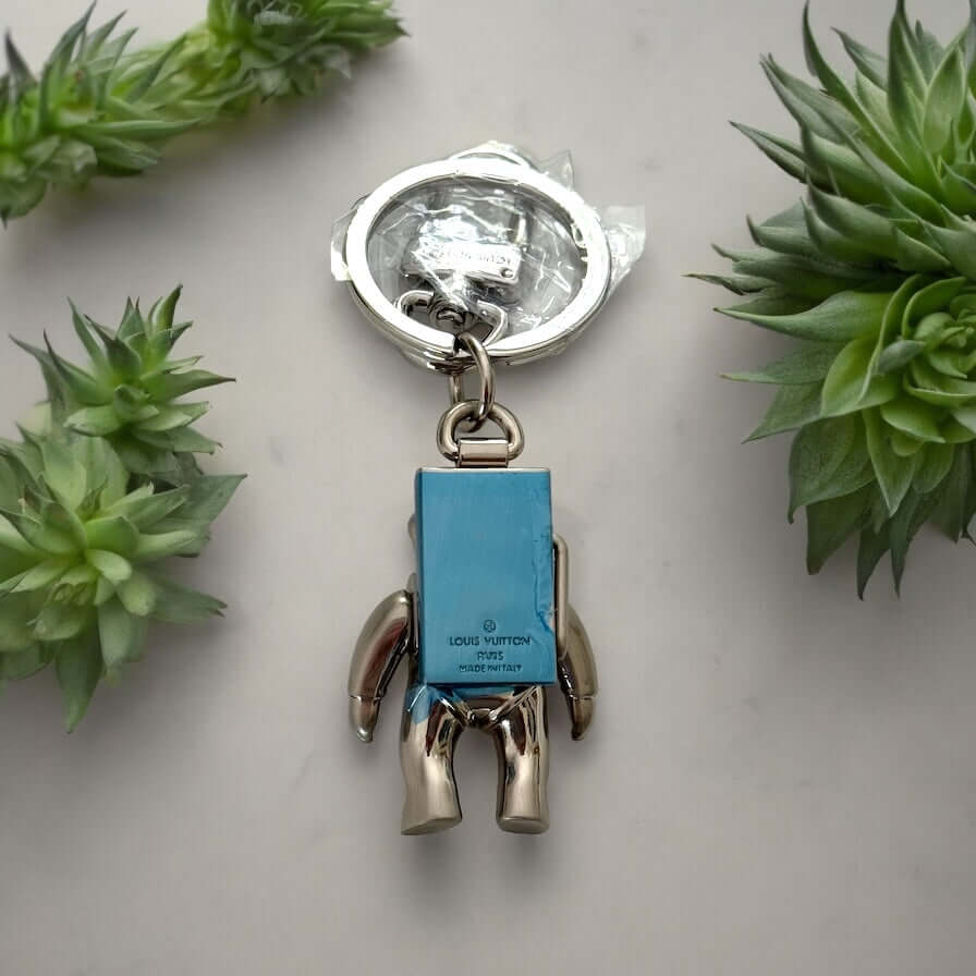 New Louis Vuitton Silver Astronaut Key Ring with Box ￼Upgrade your key game with this funky New Louis Vuitton Silver Astronaut Key Ring. Crafted from solid stainless steel, this rare and hard-to-find key chain features a playful astronaut design that is p