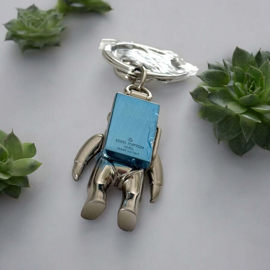 New Louis Vuitton Silver Astronaut Key Ring with Box ￼Upgrade your key game with this funky New Louis Vuitton Silver Astronaut Key Ring. Crafted from solid stainless steel, this rare and hard-to-find key chain features a playful astronaut design that is p My Mama Found What 