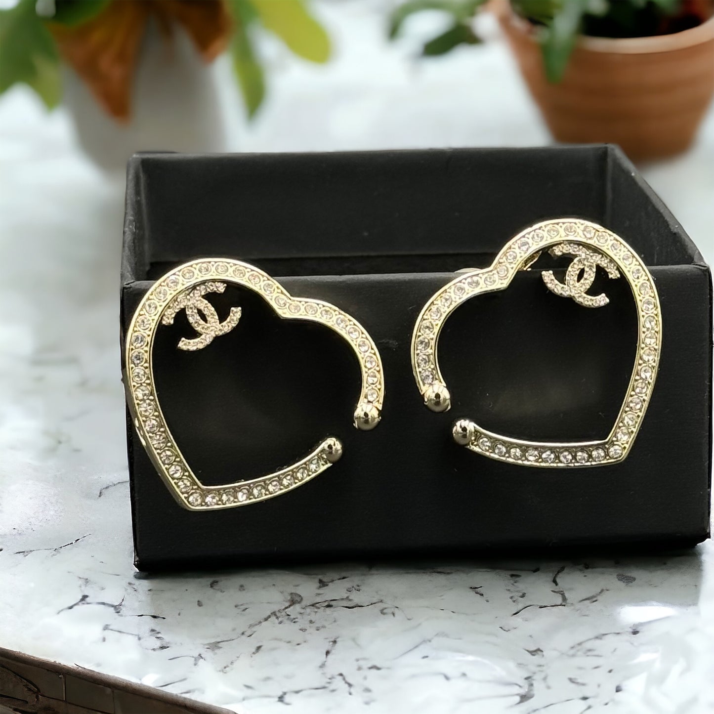 Chanel Gold Plated Big Cut Out Heart with Crystals Clip On EarringsGold Chanel Big Cut Out Heart Earrings with smaller clear crystals along the edges Purchased at an Estate Sale - The woman was an avid collector of high-end luxury designer jewelry , acces