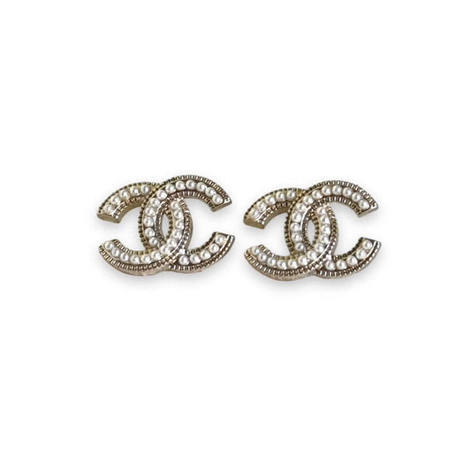 Chanel CC lighter gold tone post earrings encrusted with faux pearls, perfect for casual or dressier outfits, in like new condition. My Mama Found What 