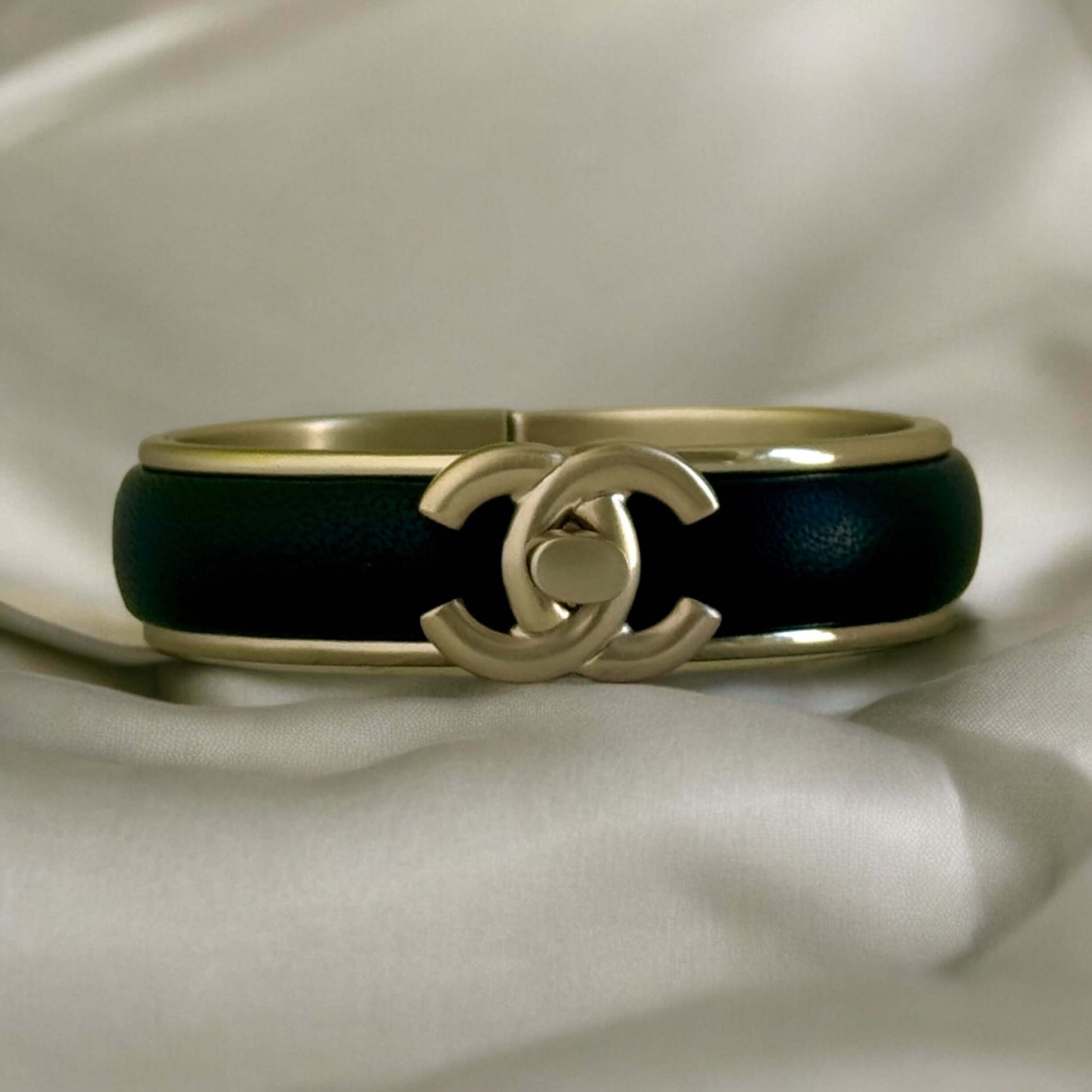 Pre-Owned Chanel Gold Blk Leather CC Lock Cuff - My Mama Found What  