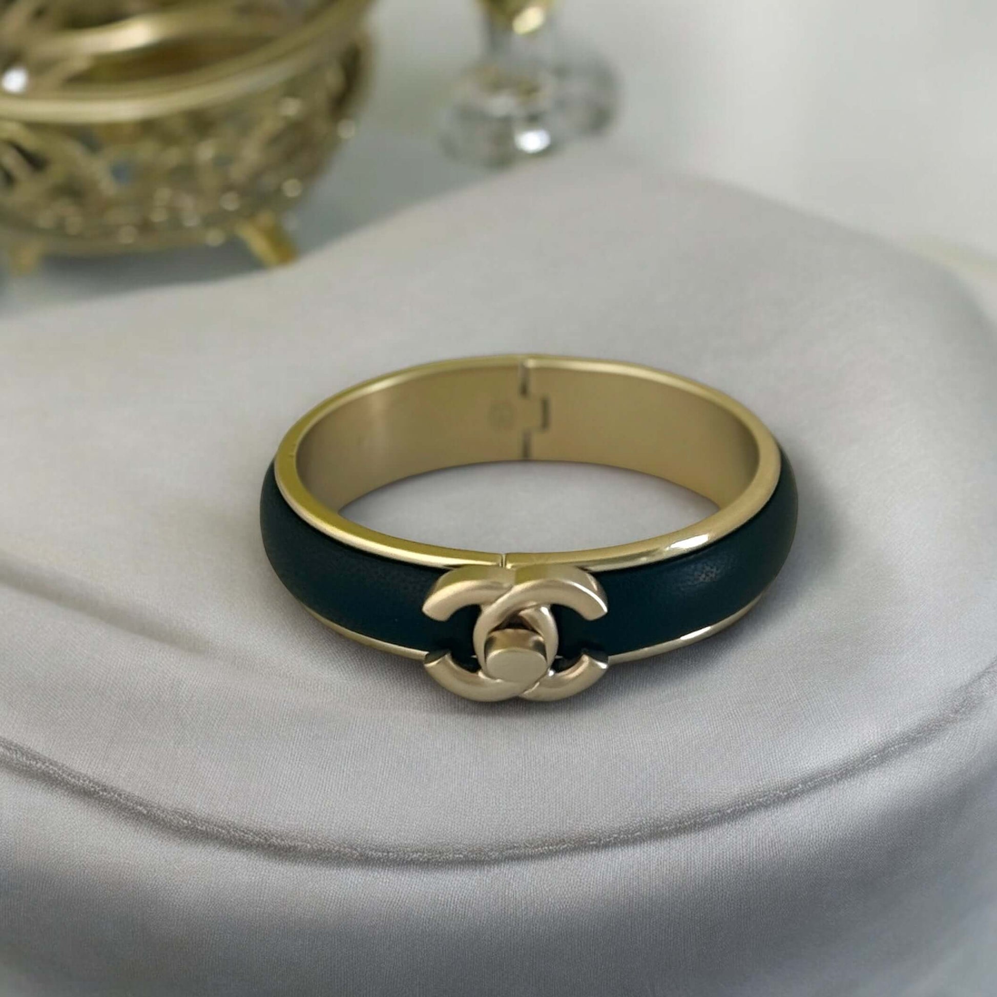 Pre-Owned Chanel Gold Blk Leather CC Lock Cuff - My Mama Found What  