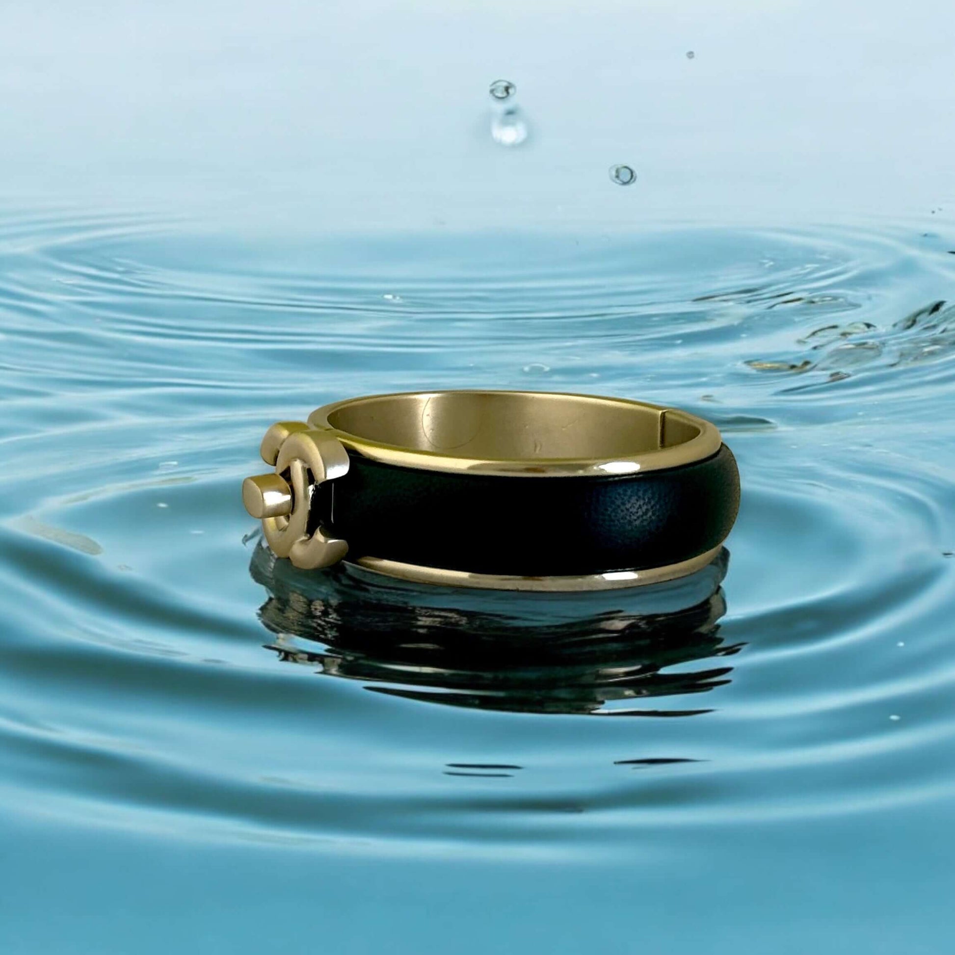 Pre-Owned Chanel Gold Blk Leather CC Lock Cuff - My Mama Found What  