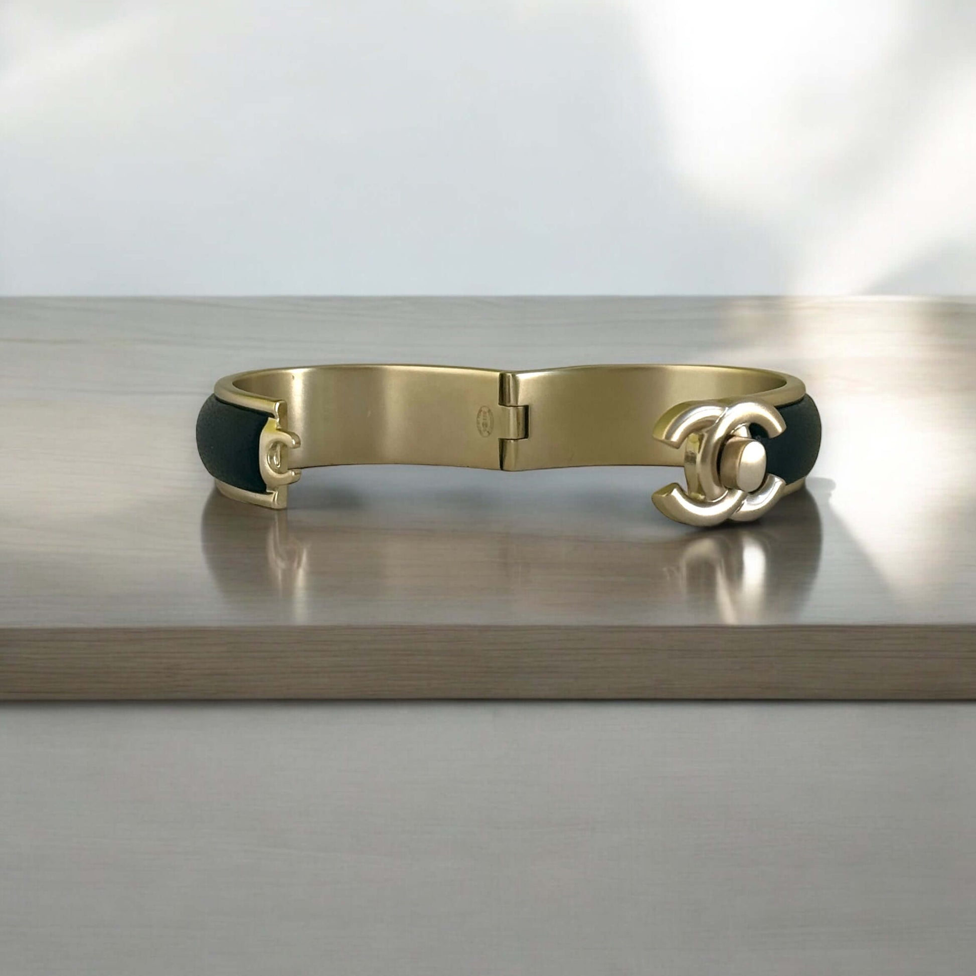 Pre-Owned Chanel Gold Blk Leather CC Lock Cuff - My Mama Found What  