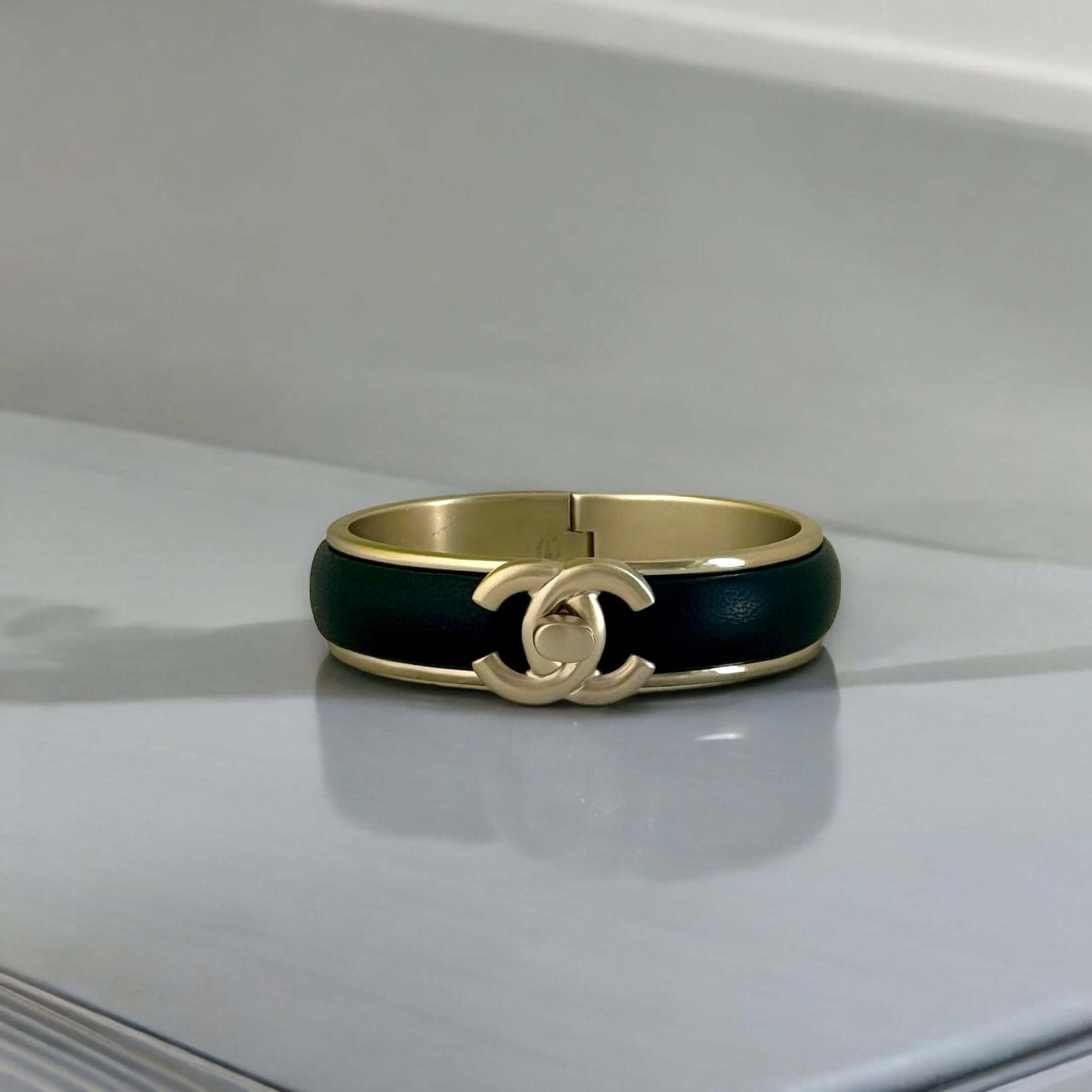 Pre-Owned Chanel Gold Blk Leather CC Lock Cuff - My Mama Found What  