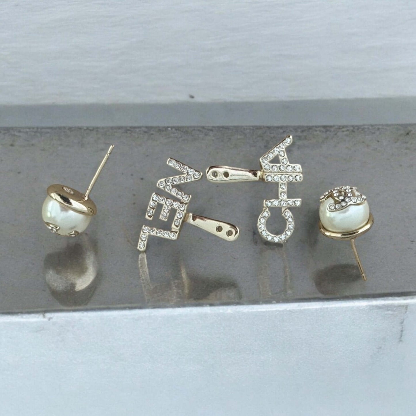 Chanel Gold CC Crystals Enamel Drop Earrings with "CHA" and "NEL" design, off-white enamel, crystal encrusted CC post, pre-owned condition. My Mama Found What 