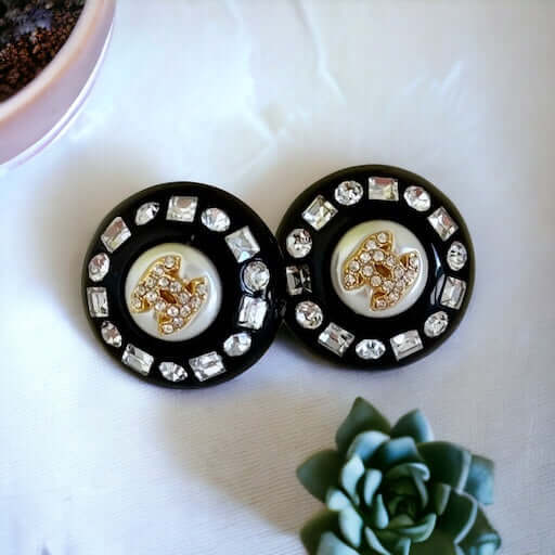 Chanel Gold Double C’s with crystals & Black Lucite Post EarringsPut a shine on your style with these Chanel Gold CC's earrings! bling eye-catching, these round earrings feature black lucite and a gold crystal centerEarringsMy Mama Found What