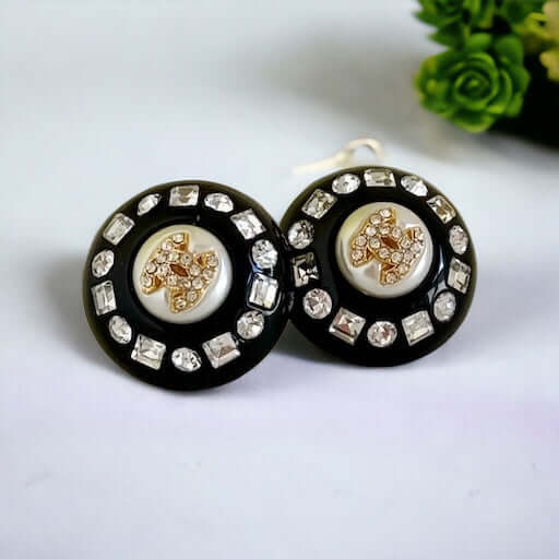 Chanel Gold Double C’s with crystals & Black Lucite Post EarringsPut a shine on your style with these Chanel Gold CC's earrings! bling eye-catching, these round earrings feature black lucite and a gold crystal centerEarringsMy Mama Found What
