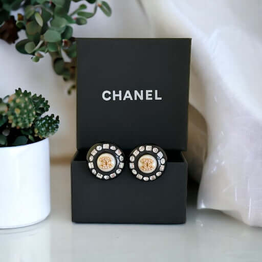 Chanel Gold Double C’s with crystals & Black Lucite Post EarringsPut a shine on your style with these Chanel Gold CC's earrings! bling eye-catching, these round earrings feature black lucite and a gold crystal centerEarringsMy Mama Found What